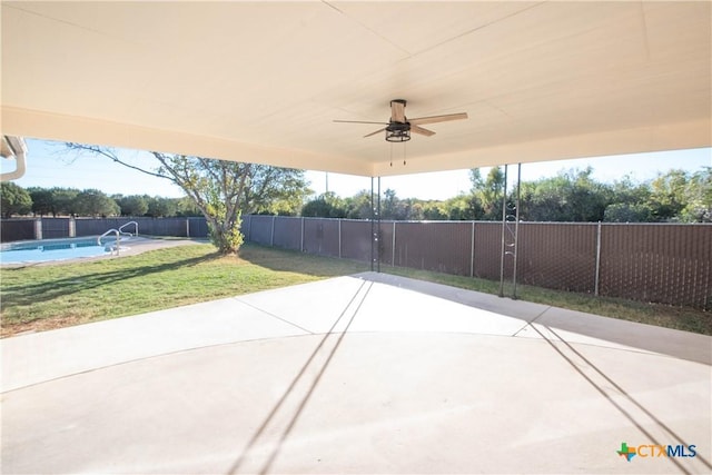 view of patio / terrace featuring ceiling fan and a fenced in pool