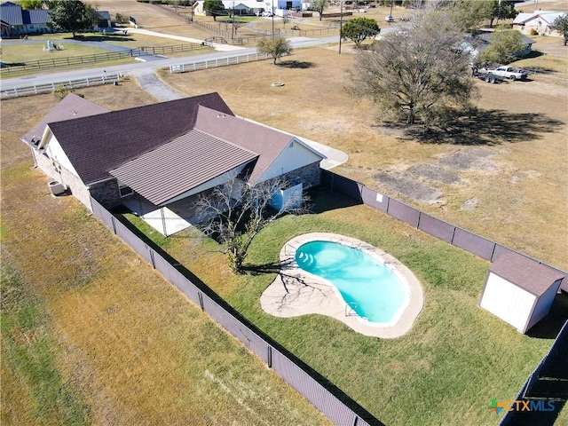 view of pool with a yard and a patio