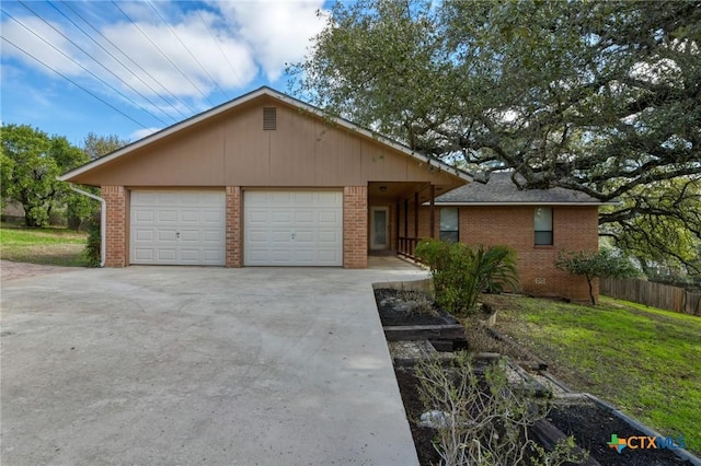 single story home with fence and brick siding