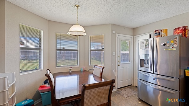 dining room featuring a textured ceiling