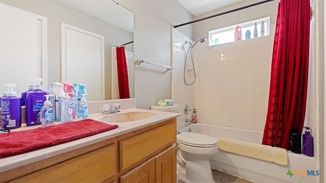 full bathroom featuring shower / bath combo with shower curtain, toilet, and vanity