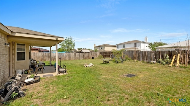 view of yard featuring a patio and a fenced backyard