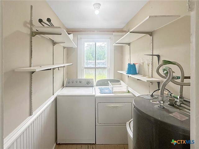 307 N Pecan St, Moulton, TX 77975 - laundry room with laundry area, water heater, and separate washer and dryer