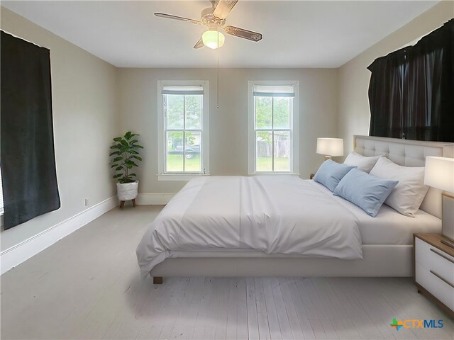 307 N Pecan St, Moulton, TX 77975 - bedroom with baseboards and ceiling fan