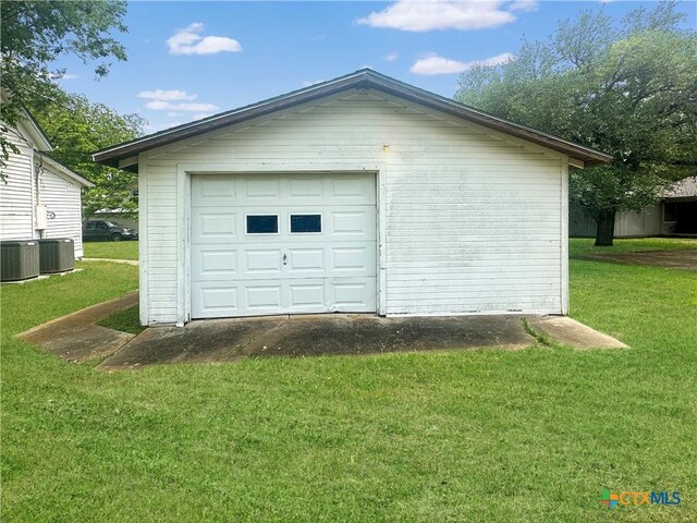 307 N Pecan St, Moulton, TX 77975 - detached garage with cooling unit and driveway
