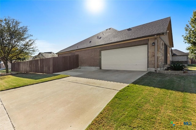 view of property exterior featuring a lawn and a garage