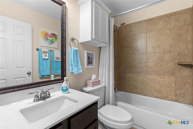 full bathroom featuring vanity, toilet, and shower / tub combo with curtain