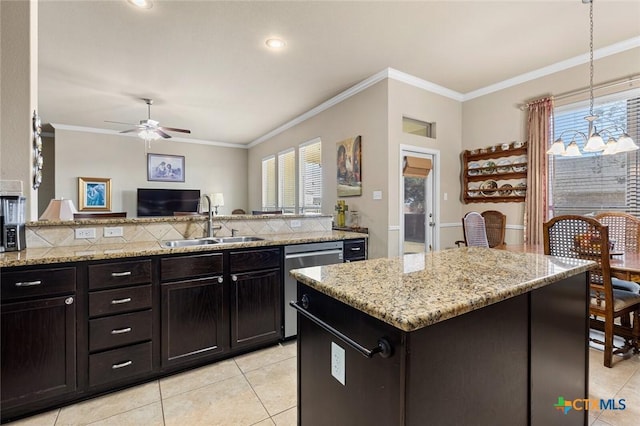 kitchen with stainless steel dishwasher, crown molding, sink, pendant lighting, and a kitchen island