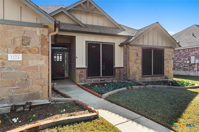 entrance to property with a yard