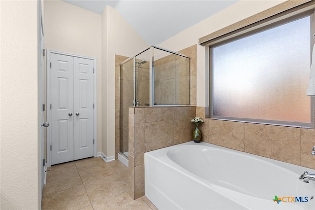 bathroom featuring separate shower and tub and tile patterned flooring