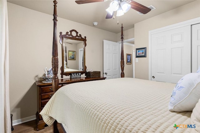 bedroom featuring wood-type flooring, a closet, and ceiling fan