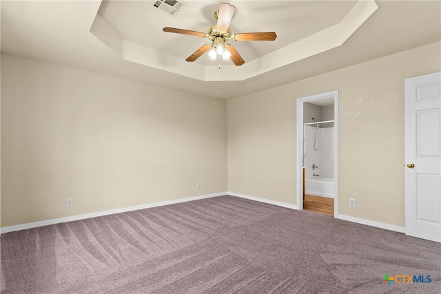 4612 Shawn Dr, Killeen, TX 76542 - unfurnished bedroom featuring a tray ceiling, ceiling fan, carpet floors, and a spacious closet