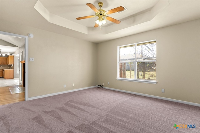 4612 Shawn Dr, Killeen, TX 76542 - carpeted empty room with ceiling fan with notable chandelier and a tray ceiling
