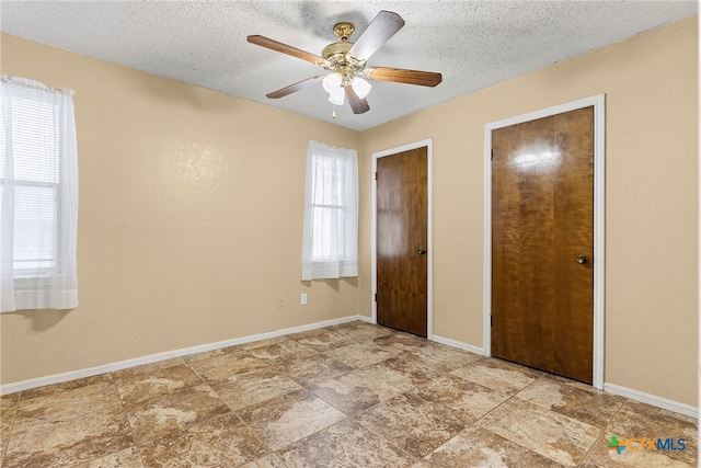 2013 Moonlight Dr, Killeen, TX 76543 - unfurnished bedroom featuring a textured ceiling and ceiling fan