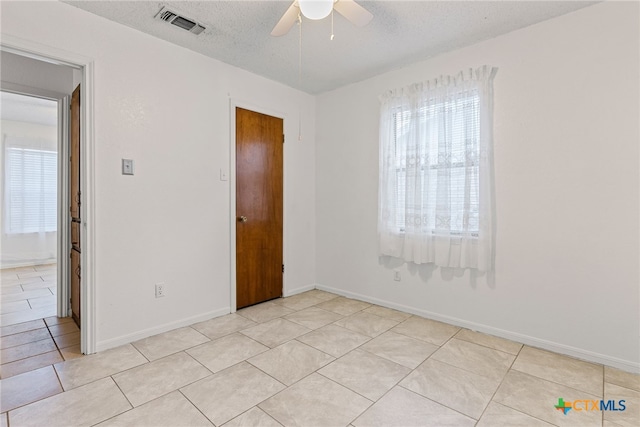 2013 Moonlight Dr, Killeen, TX 76543 - tiled spare room featuring ceiling fan and a textured ceiling