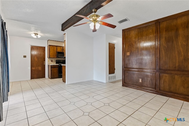 2013 Moonlight Dr, Killeen, TX 76543 - spare room featuring beamed ceiling, ceiling fan, and a textured ceiling