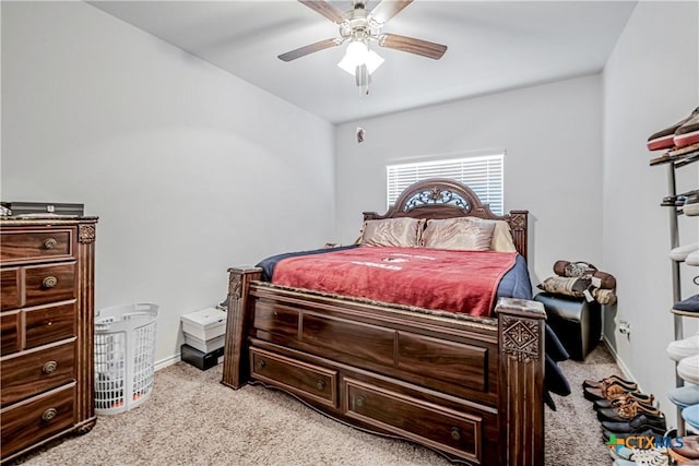 bedroom with ceiling fan, baseboards, and light carpet