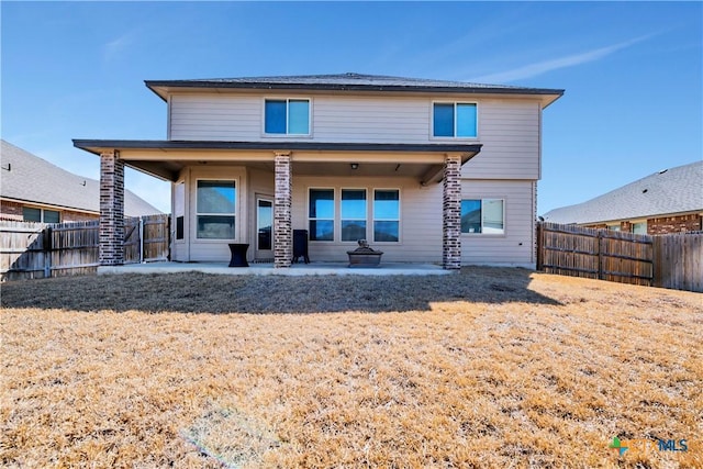 back of house with a patio and a fenced backyard