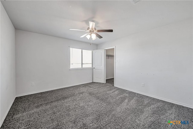 unfurnished bedroom with a ceiling fan, baseboards, and carpet floors