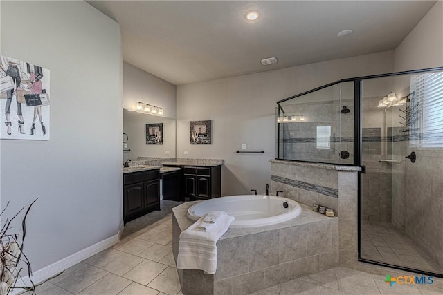 bathroom featuring tile patterned flooring, vanity, and plus walk in shower