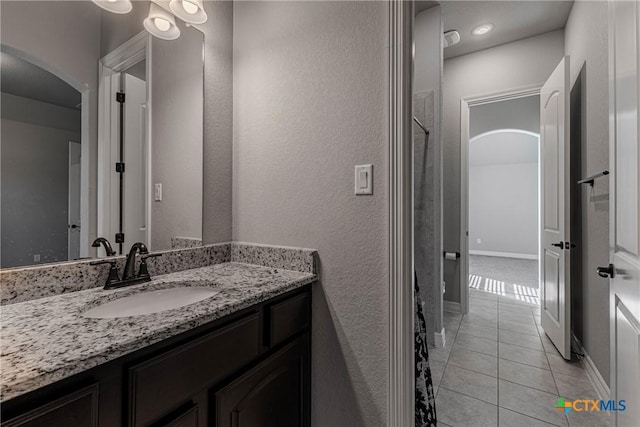 bathroom with tile patterned floors and vanity