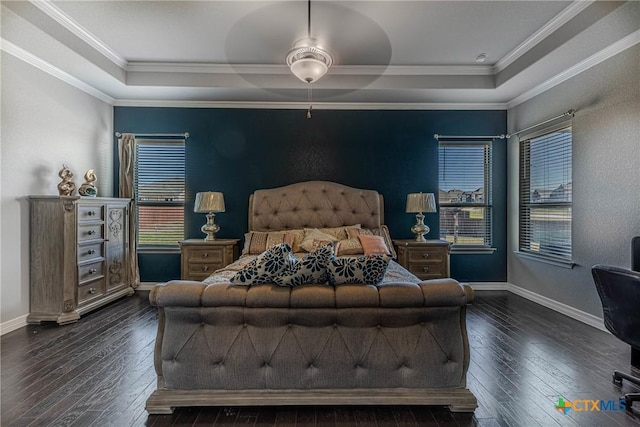 bedroom featuring a raised ceiling, crown molding, ceiling fan, and dark wood-type flooring