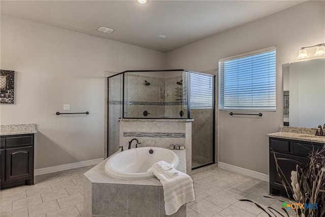 bathroom with plus walk in shower, tile patterned flooring, and vanity