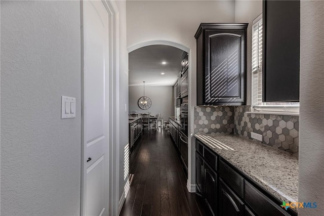 hallway featuring dark hardwood / wood-style flooring