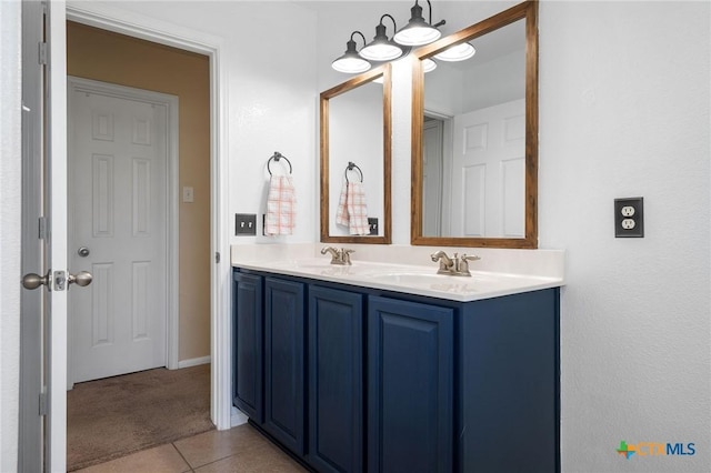 513 Leo Ln, Killeen, TX 76542 - bathroom featuring a sink, tile patterned flooring, double vanity, and a notable chandelier