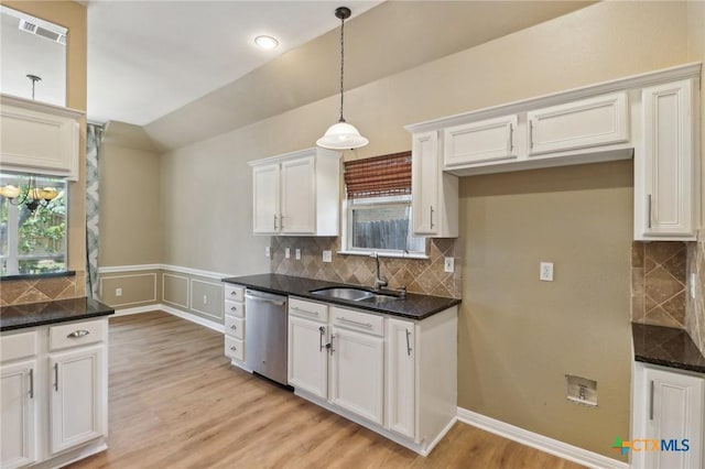 453 Raven Rdg, New Braunfels, TX 78130 - kitchen with dishwasher, a sink, plenty of natural light, pendant lighting, and a wainscoted wall