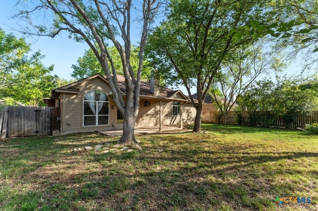 453 Raven Rdg, New Braunfels, TX 78130 - rear view of house featuring a chimney and a patio area