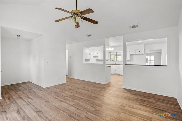 220 Briarmeadow Ln, Victoria, TX 77904 - unfurnished living room with a ceiling fan, light wood-style flooring, and lofted ceiling