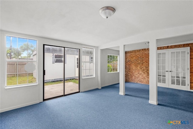 unfurnished sunroom with french doors