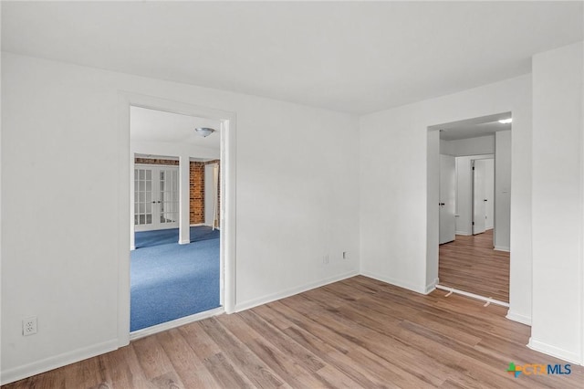 unfurnished room featuring light hardwood / wood-style floors