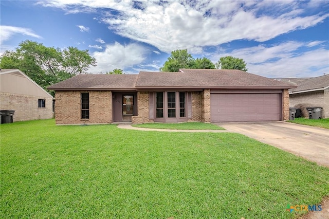 220 Briarmeadow Ln, Victoria, TX 77904 - ranch-style home featuring an attached garage, driveway, brick siding, and a front lawn