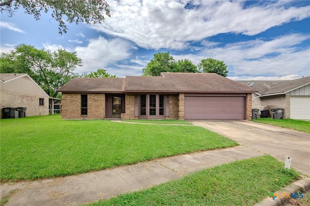 220 Briarmeadow Ln, Victoria, TX 77904 - ranch-style home with driveway, a garage, a front lawn, and brick siding