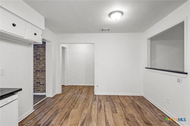 unfurnished dining area with dark hardwood / wood-style floors