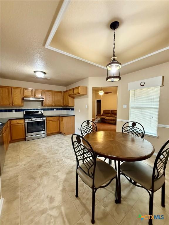 1828 Winchester Dr, Temple, TX 76502 - dining space featuring light tile patterned flooring, a textured ceiling, and ceiling fan