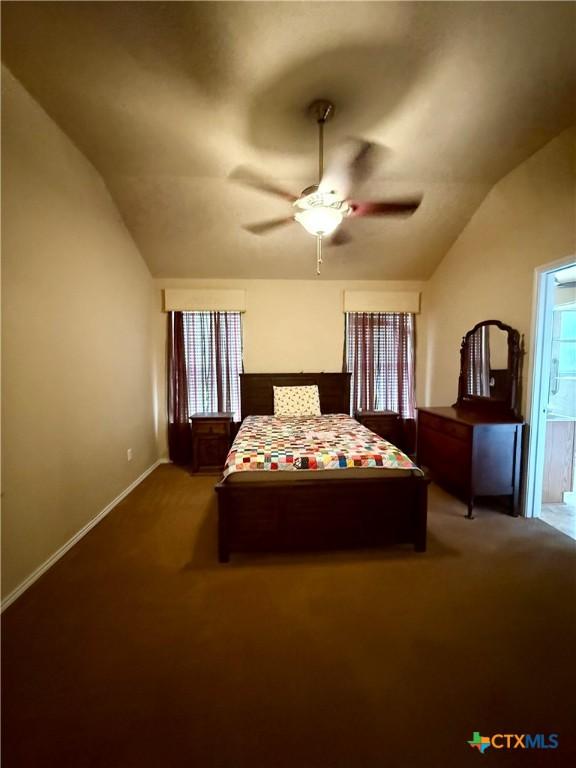 1828 Winchester Dr, Temple, TX 76502 - bedroom featuring lofted ceiling, carpet, and ceiling fan