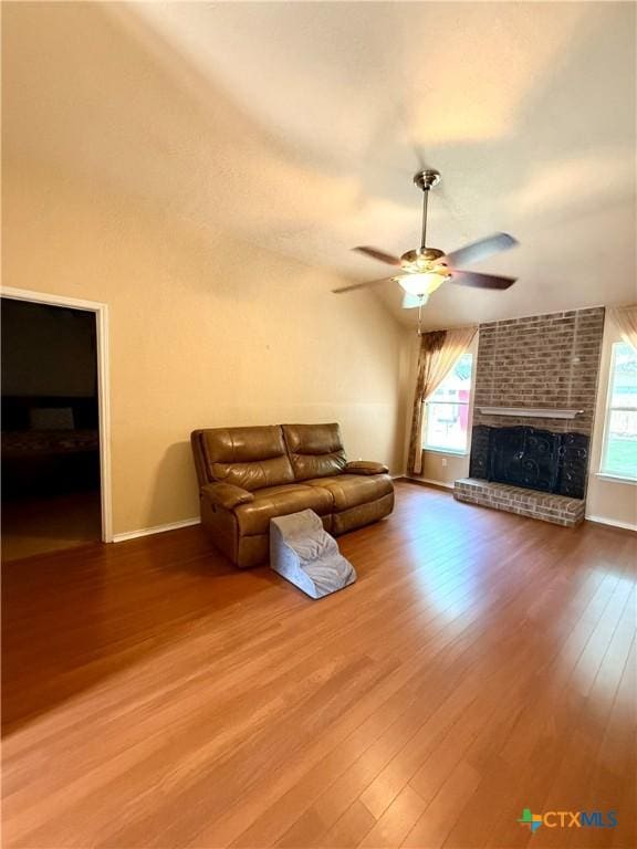 1828 Winchester Dr, Temple, TX 76502 - living area featuring healthy amount of natural light, ceiling fan, wood finished floors, and a fireplace