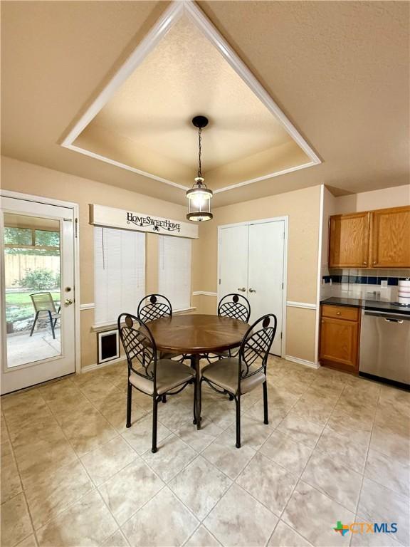 1828 Winchester Dr, Temple, TX 76502 - dining space with a raised ceiling and light tile patterned floors