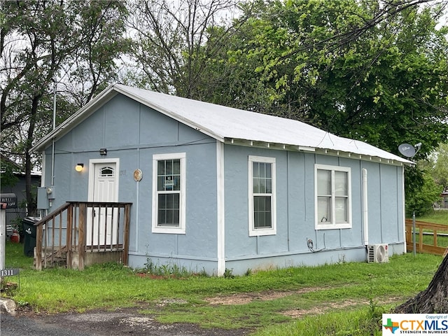 view of front of house featuring ac unit