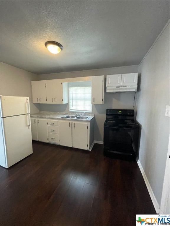 kitchen featuring white cabinetry, sink, dark wood-type flooring, white refrigerator, and black range with gas stovetop