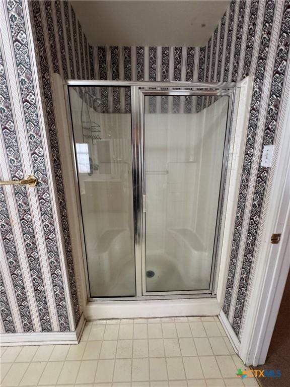 full bath featuring a shower stall