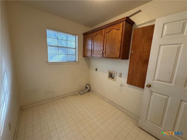 laundry room featuring cabinet space, washer hookup, and electric dryer hookup