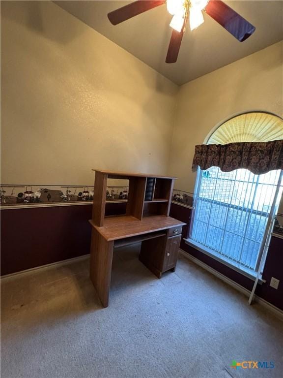 office area featuring ceiling fan and dark carpet