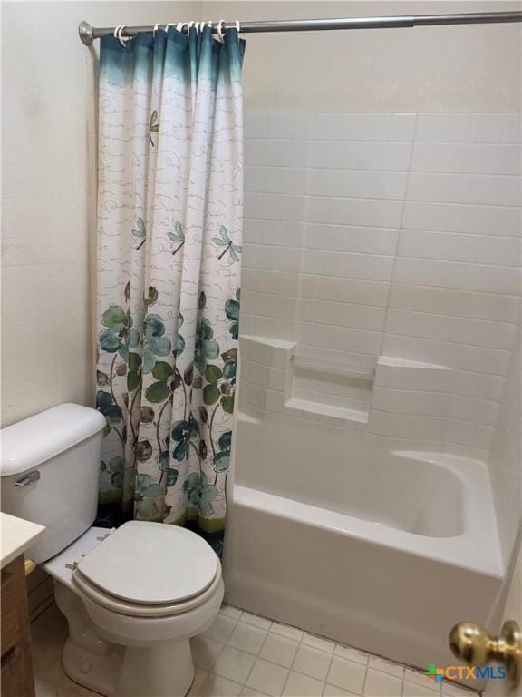 full bath with toilet, tile patterned flooring, shower / bath combo with shower curtain, and vanity