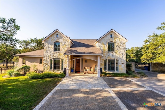 9063 Schoenthal Rd, San Antonio, TX 78266 - french country inspired facade with stone siding, a porch, and stucco siding