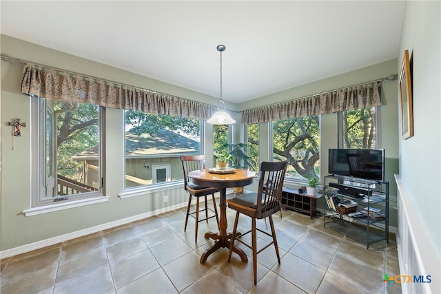 9063 Schoenthal Rd, San Antonio, TX 78266 - dining area with baseboards and tile patterned flooring