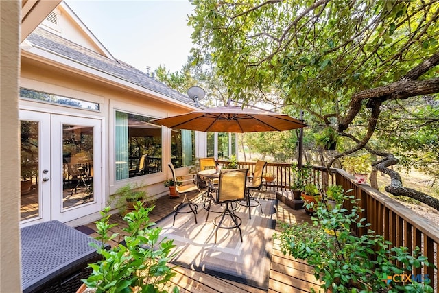 9063 Schoenthal Rd, San Antonio, TX 78266 - wooden terrace with outdoor dining area and french doors